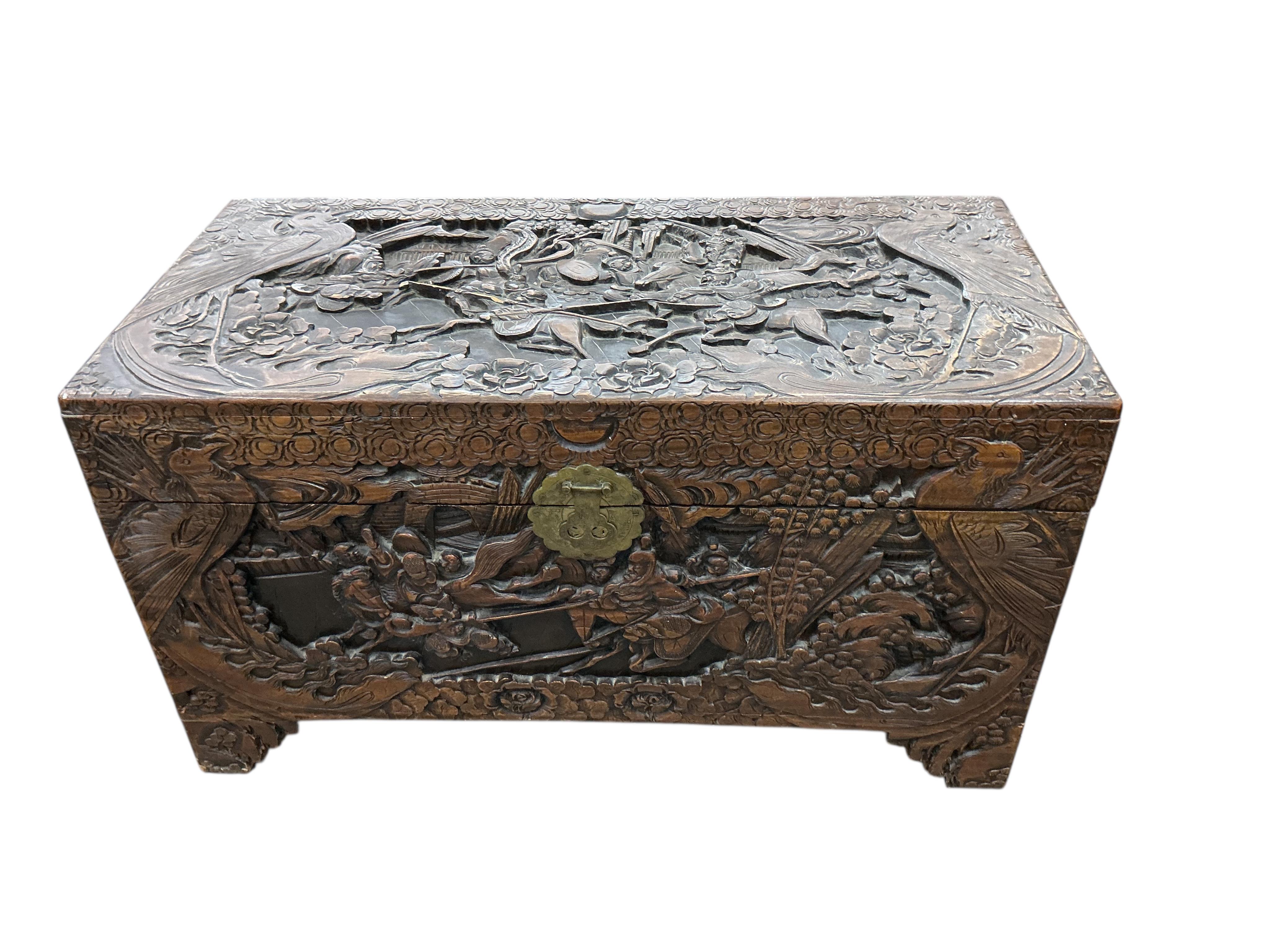 A Chinese carved camphorwood trunk, width 97cm, depth 47cm, height 54cm